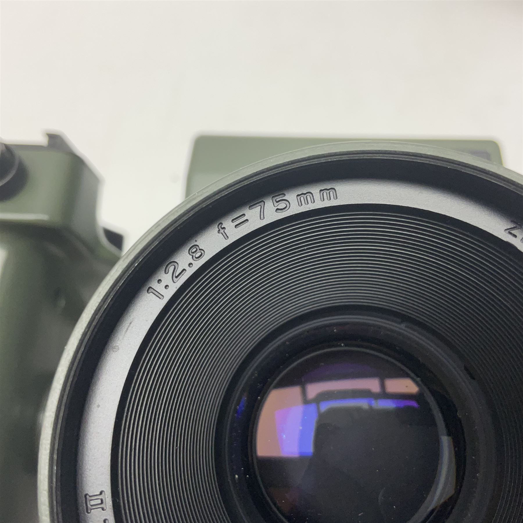 Zenza Bronica ETRS camera body, safari edition, serial no. 7100811, with 'Zenza Bronica Zenzanon EII 1:2.8 f=75mm' lens, serial no. 7908591, film magazine back, safari, serial no. 8100564, AE-ii metering head, safari, serial no. 617024, etc, all in leather case