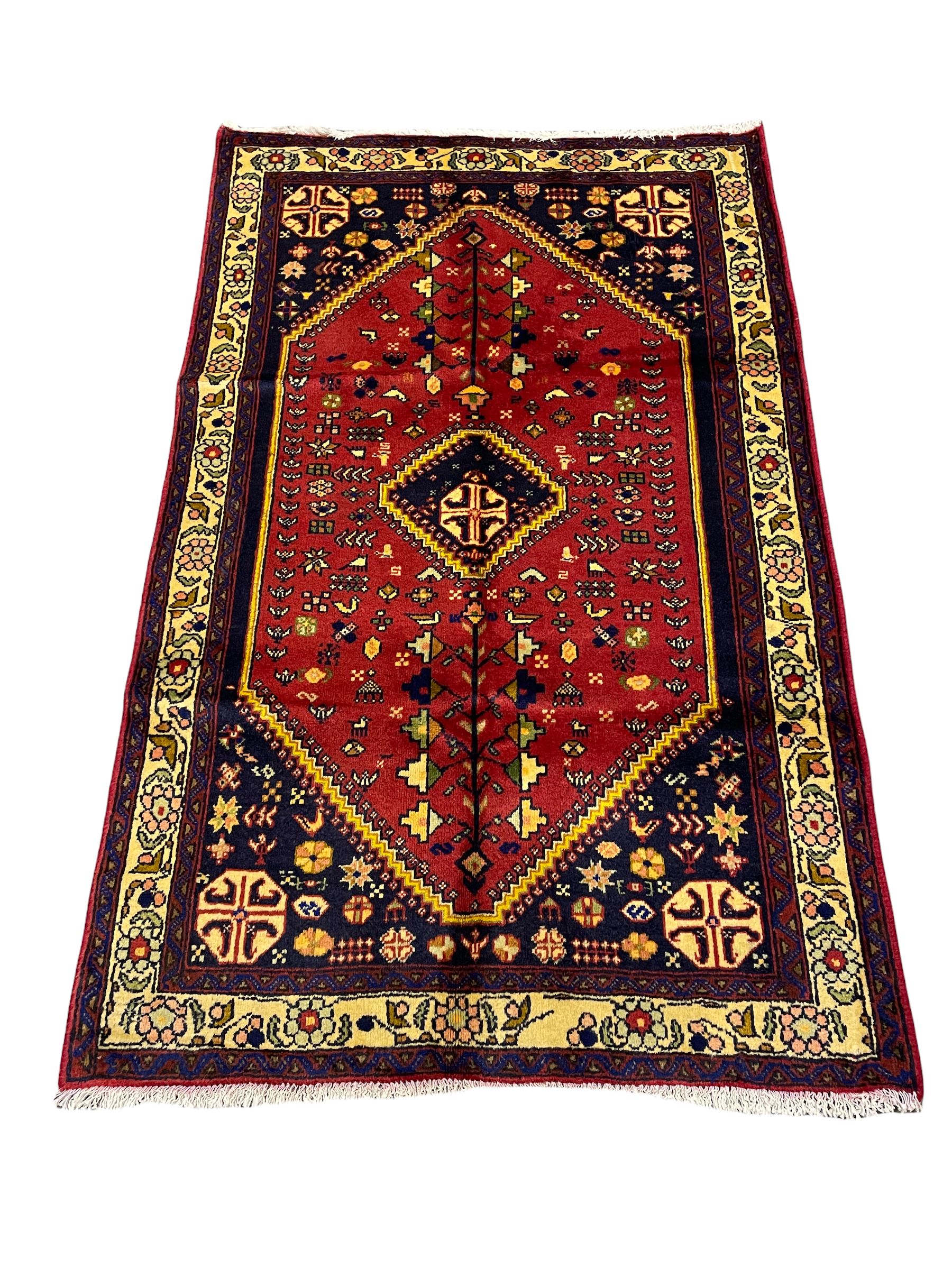 Small Persian Abadeh rug, blue ground with red lozenge field decorated with small bird and plant motifs, triple band border with floral design