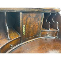 Small early 20th century Queen Anne style bookcase on bureau secretaire, the moulded arched pediment over mirrored door in shaped frame, the bureau fitted with fall front enclosing curved fitted interior, cushion moulded drawer over single drawer, on scroll and shell carved cabriole supports