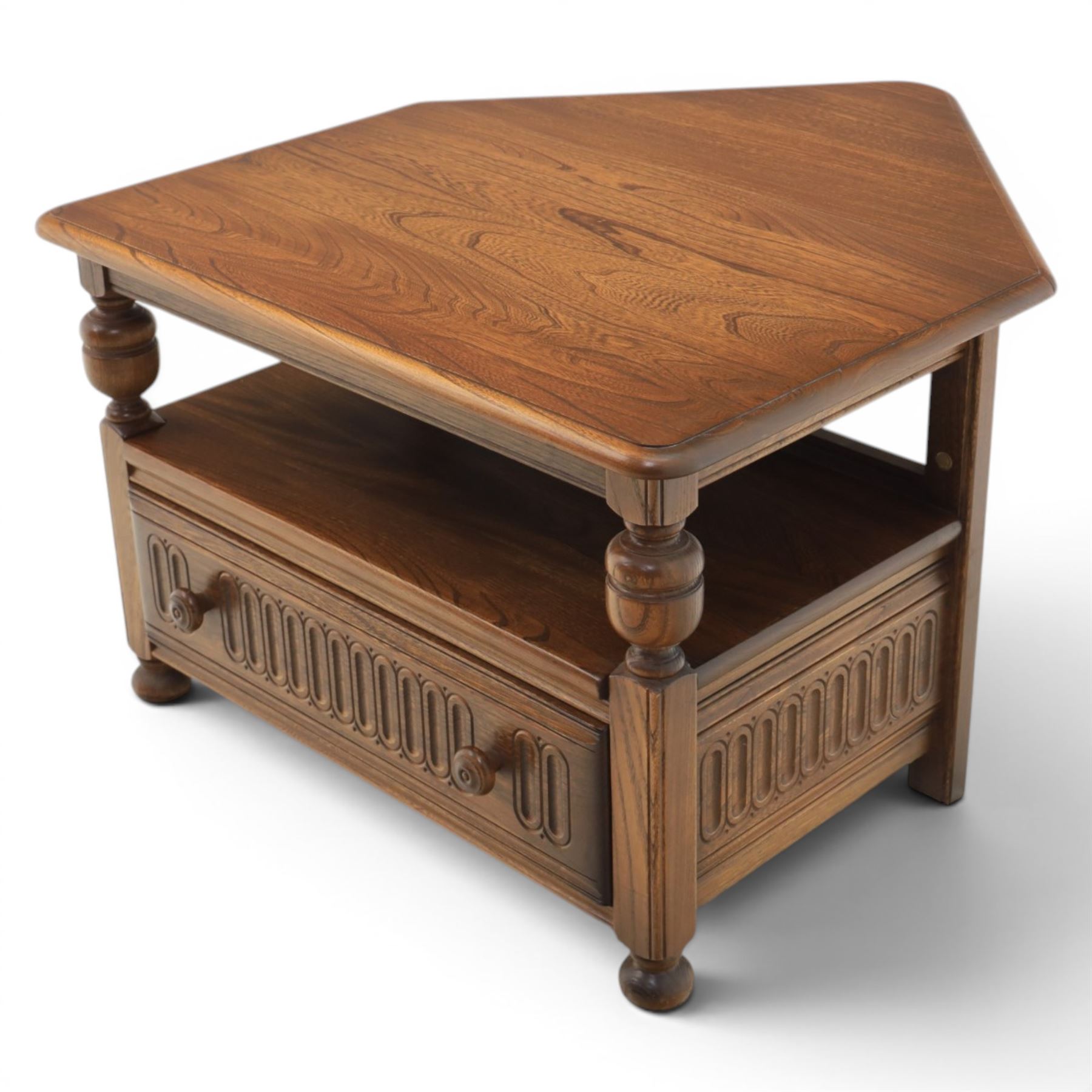 Ercol -  dark elm corner TV stand and coffee table, TV stand with drop triangular leaf, over open recess above a single drawer (H 47cm, D 44cm with leaf 79cm, W 73cm,  the coffee table with chamfered rectangular top with full length undertier, raised on turned supports (H 43cm, D 54cm, W 115cm) 