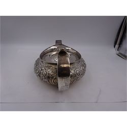 George III Irish silver teapot, of squat circular form, the body with repousse and chased floral and C scroll decoration, with capped C handle and ivory insulators, engraved to base 'Presented to Troop Sergeant Major John Percival, of the 4th Dragoon Guards by Alex D. Tait, Esq, late Captain in that corps as a mark of approbation of his steady and upright conduct when Sergeant Major of his Troop, Dublin, June 2nd 1843', hallmarked William Law, Dublin 1817, H12.5cm, This item has been registered for sale under Section 10 of the APHA Ivory Act