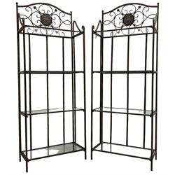 Pair of wrought metal conservatory plant stands, raised back with scrolling design, each fitted with three glass shelves