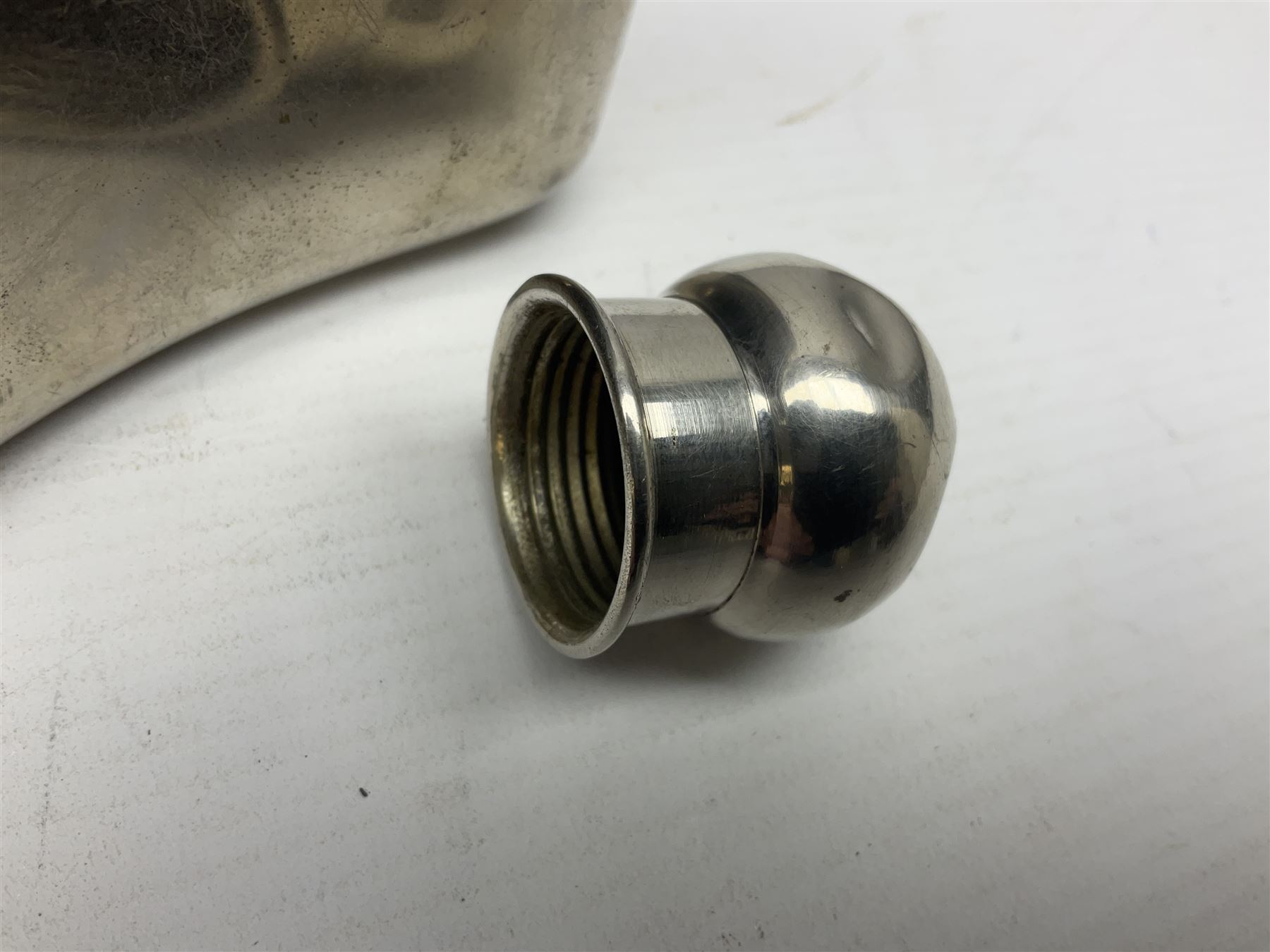 Silver plated glass and pressed leather hip flask, with swivel cap and removable cup, together with a similar oval example, engraved with wreath and initial B, tallest H16.5cm