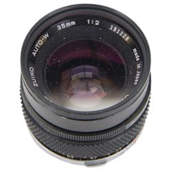 Olympus OM-4 T camera body serial no. 1126911, with two Olympus OM-System Zuiko MC Auto-S lenses, one 1:1.54 f=50mm, the other 1:1.8 f=50mm, an Auto-W 35mm 1:2 lens, Olympus OM winder 2, flash and other accessories, in a Tamrac carry case 