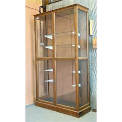  large glazed oak shop display cabinet, early 20th century, four doors enclosing later she...