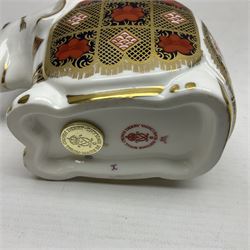 Royal Crown Derby paperweight, Elephant, printed in the 1128 pattern, trunk raised, gold stopper, H10cm