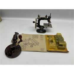 Dinky Kit No.1029 Ford D800 Tipper Truck in unopened original packaging; American Singer child's sewing machine; Spong's table mounting Bean Slicer No.632; and two wall mounting wooden die-cast model open display racks (5)