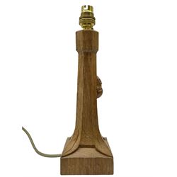 'Mouseman' tooled oak table lamp with tapered octagonal stem on leaf carved square base, carved mouse signature, by Robert Thompson of Kilburn 