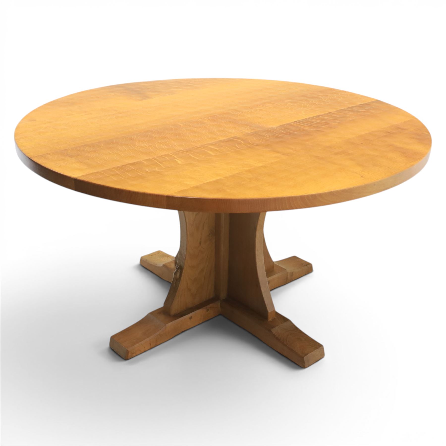 Mouseman - circular adzed oak circular dining table, on quatriform base with carved mouse signature, by the workshop of Robert Thompson of Kilburn