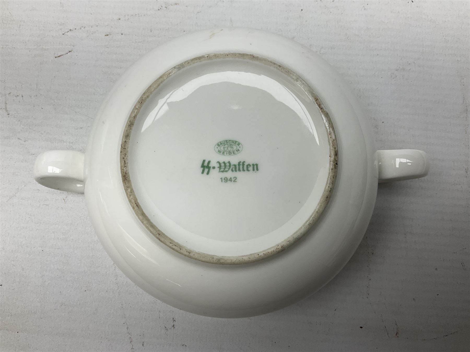 Thun WW2 German Luftwaffe officer's mess plain white glazed soup tureen with lion mask handles, marked with the Luftwaffe eagle beneath and dated 1939 L31cm; together with Waffen 'SS' white glazed twin handled soup bowl, marked beneath Bauscher Weiden 1942 (2)