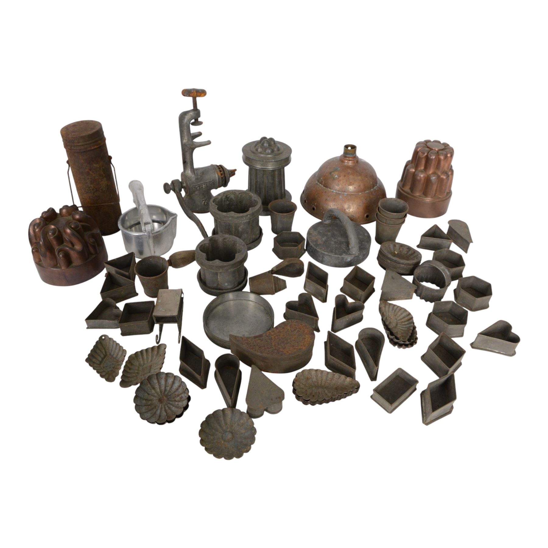 Two copper jelly moulds, collection of metal cookie cutters and moulds, LF&C nut butter grinder, fruit press and other metalware