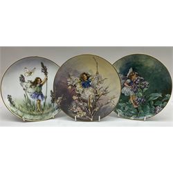 Four Royal Doulton Images figures comprising 'Happy Anniversary', 'Wedding Day', 'Congratulations' and 'Carefree', together with a set of three Heinrich collectors plates depicting Fairies.