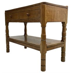 Mouseman - circa. 1950s oak serving table, adzed rectangular top over two drawers, on octagonal supports joined by adzed undertier, the rear right leg carved with mouse signature, by Robert Thompson of Kilburn