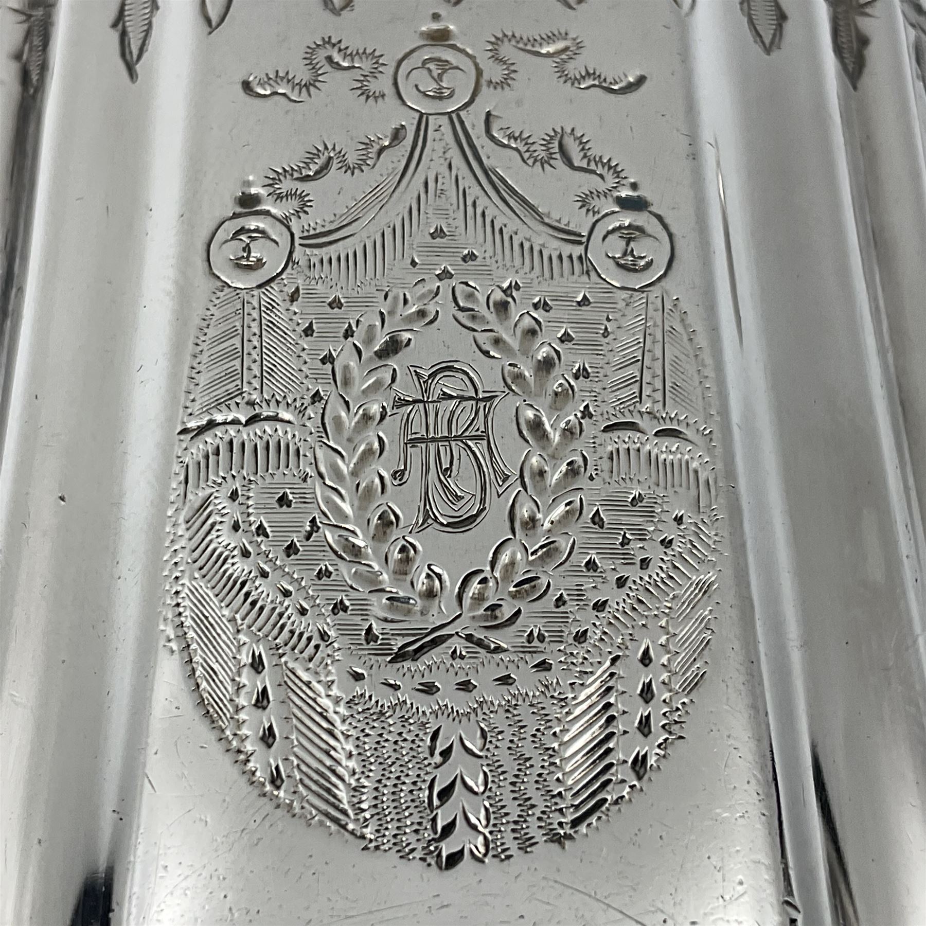 Victorian three-piece silver tea service, comprising teapot, twin handled open sucrier and milk jug, of oval form with shaped rim and C handles, each engraved with crests and bands of strapwork decoration, the milk jug and sucrier with gilt interiors, hallmarked Josiah Williams & Co, Exeter 1881, the teapot with ivory insulators and finial, all contained with a tooled leather, blue silk and velvet lined fitted case, retailed by West & Sun, Dublin 
This item has been registered for sale under Section 10 of the APHA Ivory Act