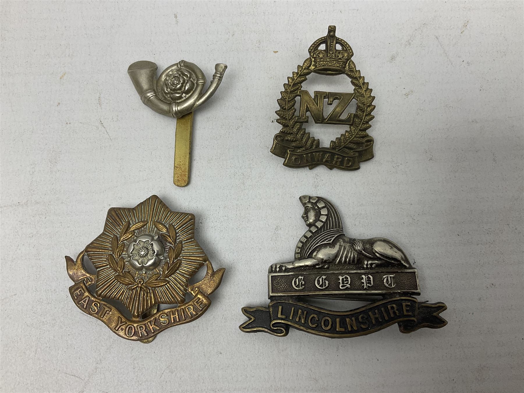South African Army Orange Free State Artillery badge; three Commonwealth badges; and twelve Yorkshire/Lincolnshire badges including East Yorkshire, West Riding, York and Lancaster, West Yorkshire etc (16)