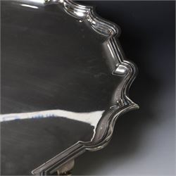Early 20th century large silver salver, of circular form with Chippendale style rim, upon four hoof feet, hallmarked Elkington & Co Ltd, Birmingham 1918, D47cm