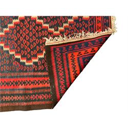 Turkish Kilim indigo ground runner rug, field with four connected lozenges with red and ivory borders, multi-band border decorated with repeating geometric patterns