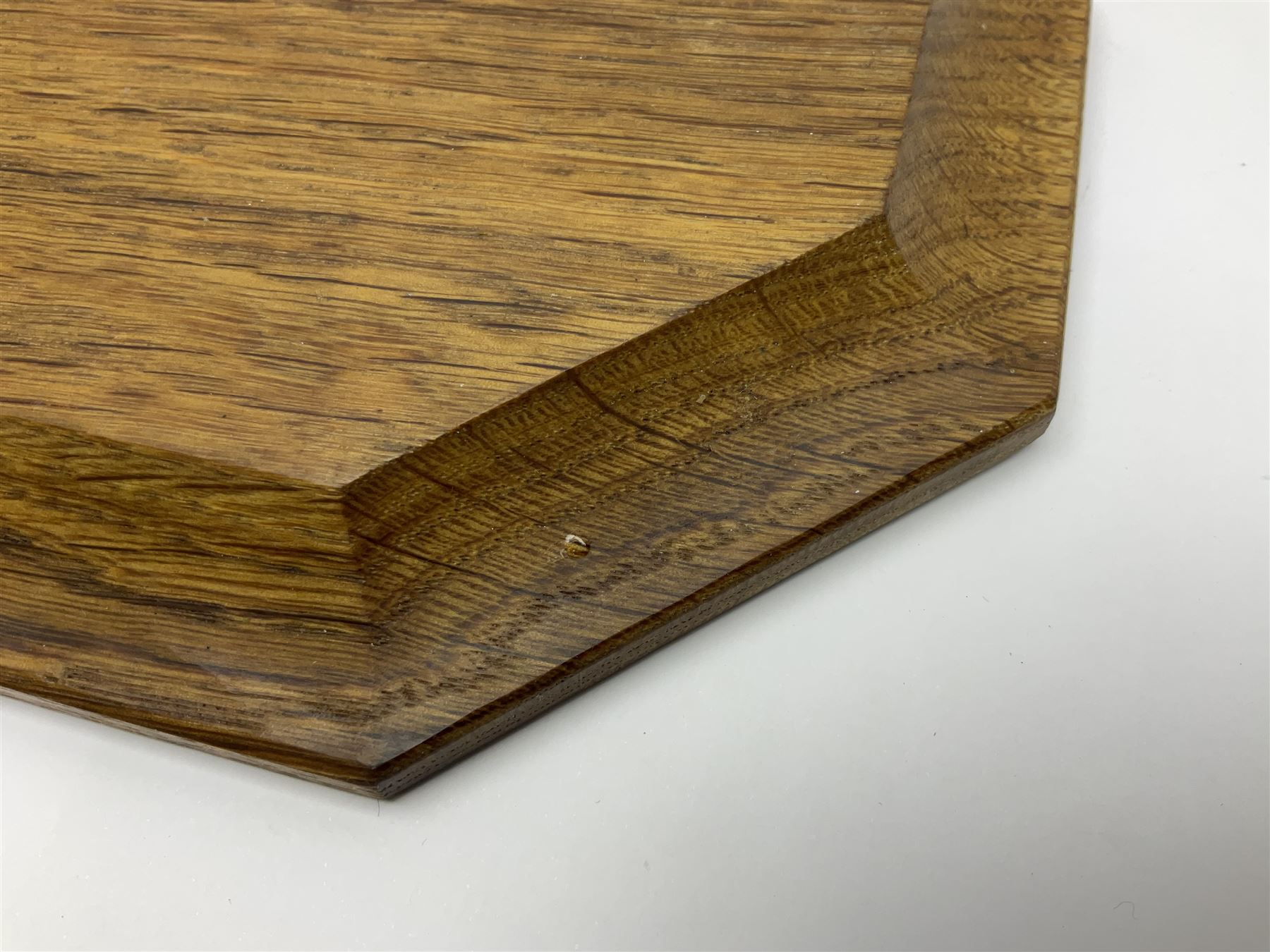 Mouseman - oak octagonal chopping board or teapot stand, moulded edge carved with mouse signature, by the workshop of Robert Thompson, Kilburn