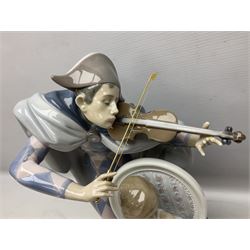 Lladro figure, Jester Serenade, modelled as a ballerina with bouquet of flowers seated before a jester playing the violin, limited edition 2541/3000, sculpted by Antonio Ramos, no 5932, with original box, year issued 1993, year retired 1994, H37cm