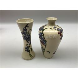 Two Moorcroft vases decorated in the Bluebell Harmony pattern by Kerry Goodwin, comprising a shouldered ovoid example and a slender waisted form example, both with impressed marks and stamps beneath, tallest H16cm