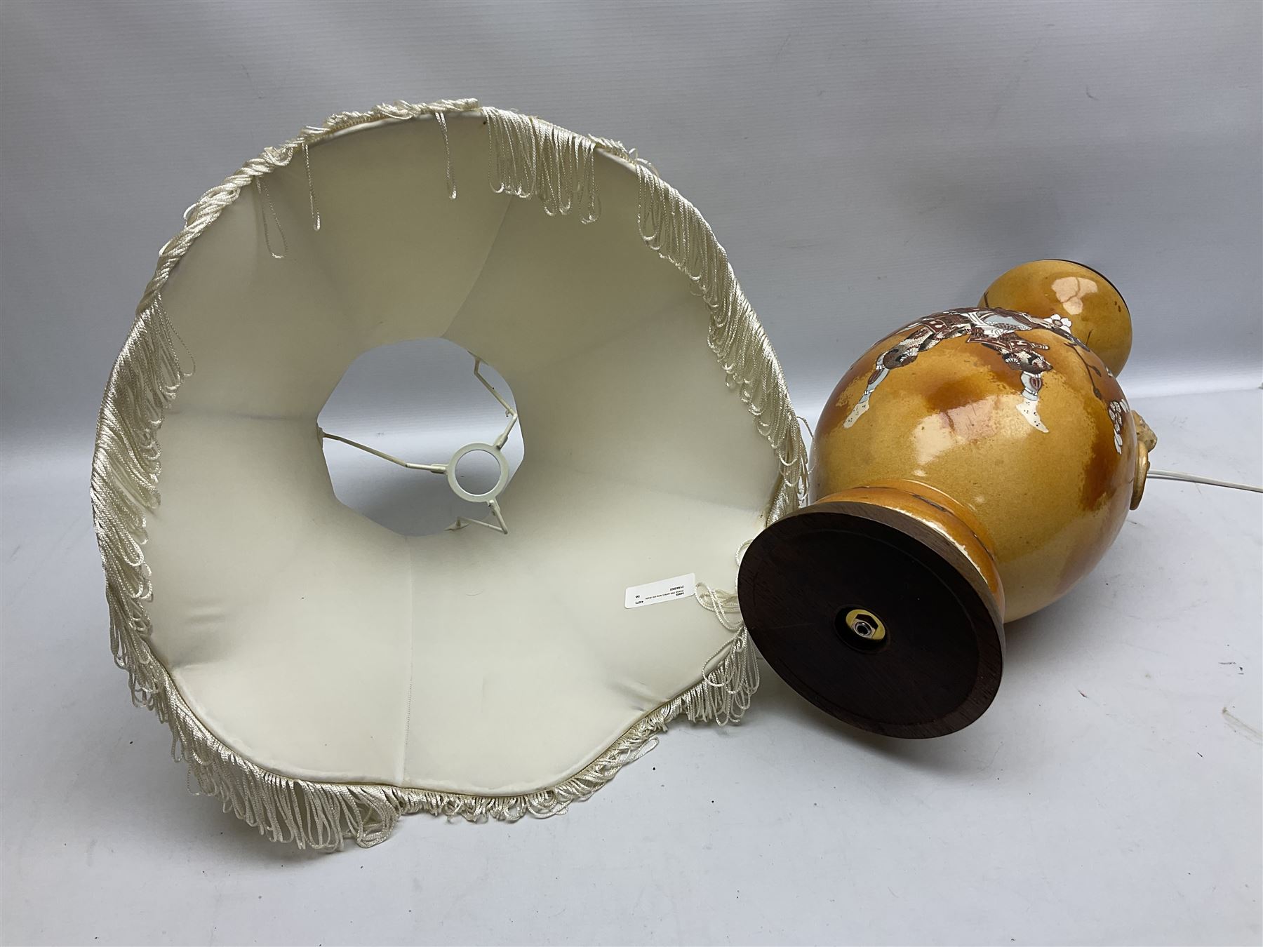 20th century Japanese vase converted to a lamp, the baluster form body decorated with samurai warriors and blossoming branches with twin handles, with wood base and fixtures, with tasselled fabric shade, H56cm excl shade