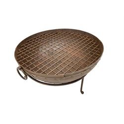 Circular riveted iron fire pit, strapwork sides with twin handles on stand, with grate