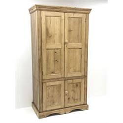 *Traditional pine larder cupboard, projecting moulded cornice over four panelled doors, shaped plinth base, W101cm, H191cm, D56cm