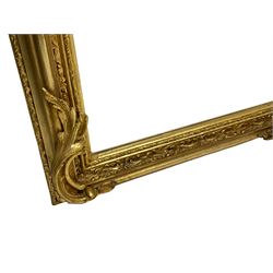 Victorian design gilt overmantel mirror, central cartouche pediment with extending leafy branches decorated with flower heads held by winged putto,  moulded frame decorated with repeating foliate patterns, scrolled acanthus leaf lower brackets, bevelled mirror plate