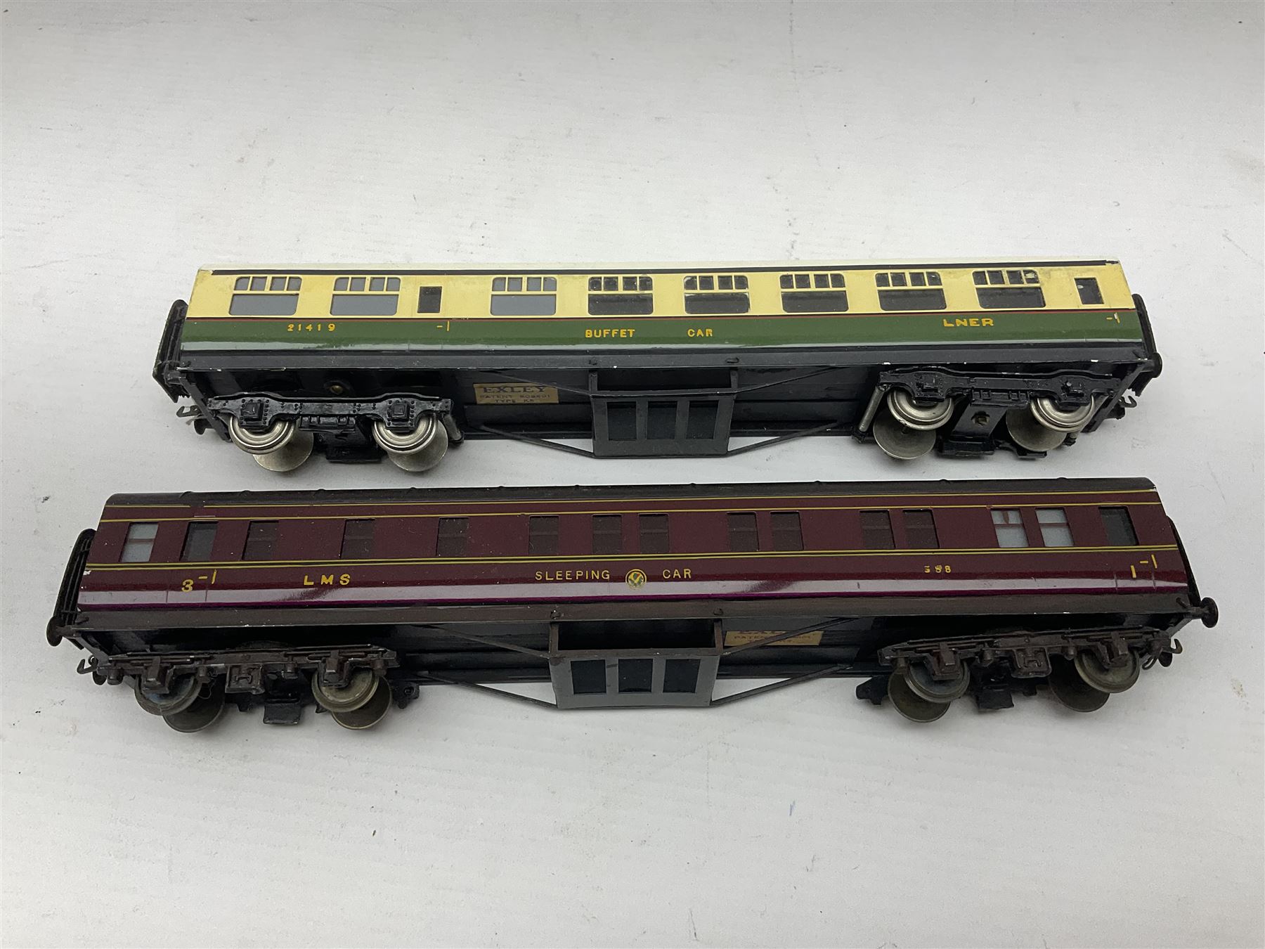 Exley '00' gauge - fourteen various coaches comprising four LMS maroon (3322 3rd, 2202 3rd, 6665 3rd and 388 Sleeping Car 3rd), LNER green/cream Buffet Car 21419, LNER teak 8639 1st, Southern green 6688 3rd, GWR brown/cream 3322 3rd, LNER 206 3rd, LNER 319 1st/3rd, SR green 351 3rd, SR green 188 Parcel Van, GWR 331 3rd and GWR 362 3rd; all unboxed (14)