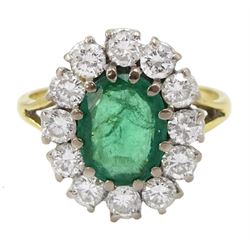 18ct gold oval emerald and round brilliant cut diamond cluster ring, Birmingham 1987, emerald approx 1.00 carat, total diamond weight approx 0.70 carat