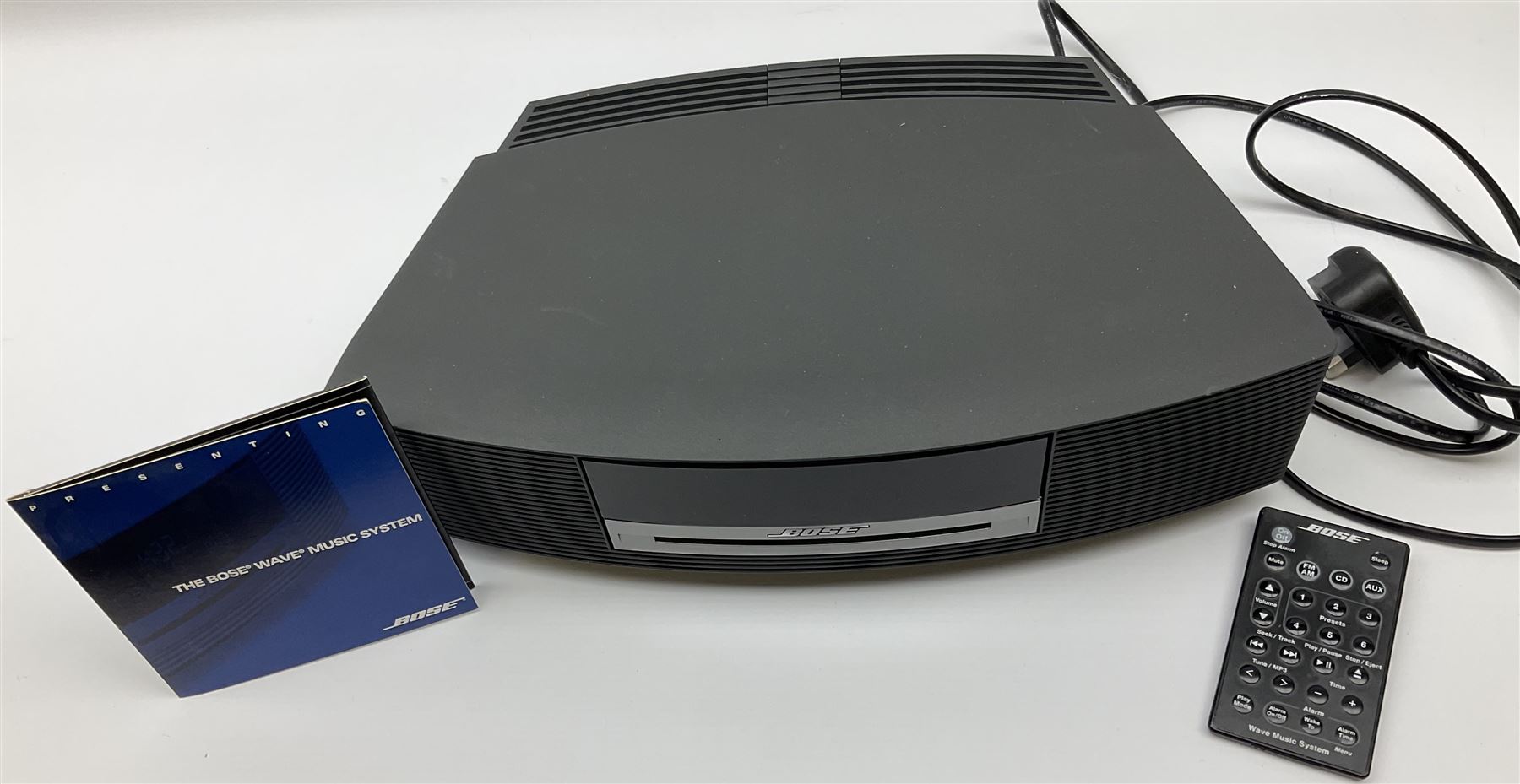 A Bose Wave music system, model AWRCC5, with remote control. 