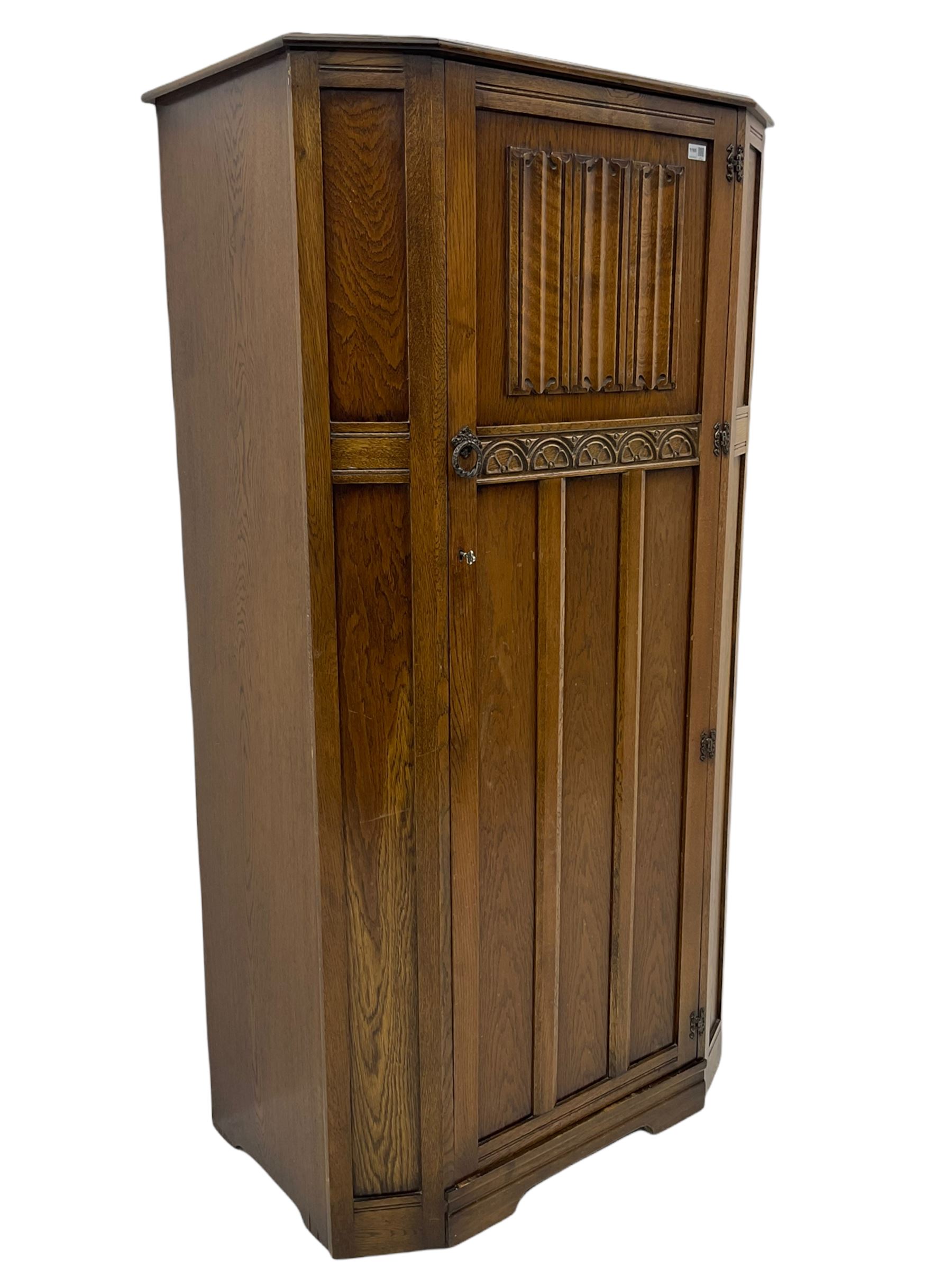 Early to mid 20th century oak hall wardrobe, single door with linenfold panel