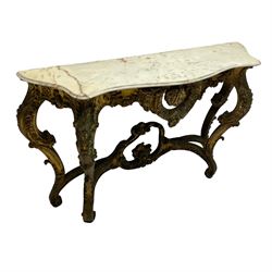 French Rococo design console or pier table, shaped and moulded pale marble top, the apron carved with pierced shell and scrolling acanthus leaves, extending flower head decoration, on four acanthus carved cabriole supports with scrolled terminals, united by shell moulded stretcher rails with central scrolled foliage cartouche 