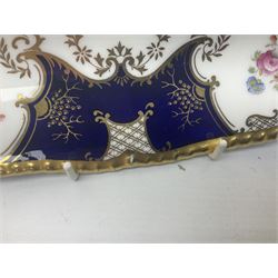 Coalport cobalt blue batwing pattern tea wares, decorated with finely enamelled floral sprays within gilt reserves, comprising teacup trio, coffee can and saucer and other cup and saucer, twin handled cake plate, milk jug and open sucrier, and circular plate retailed by T. Goode & Co London, pattern no Y2665,  all with green Coalport AD 1750 marks beneath, largest W26cm (11)