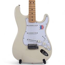 Fender Stratocaster electric guitar, serial no. P093223 made in Japan c.1993, with cream body, white scratch plate, maple neck, three pickups, three control dials and five way selector switch, in a black Fender USA hardcase, guitar L99cm