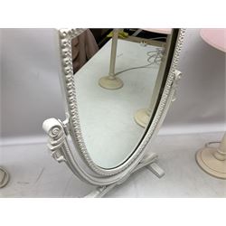 Four white / cream table lamps with pink shades and an ornate mirror of shield form,  mirror H49.5cm