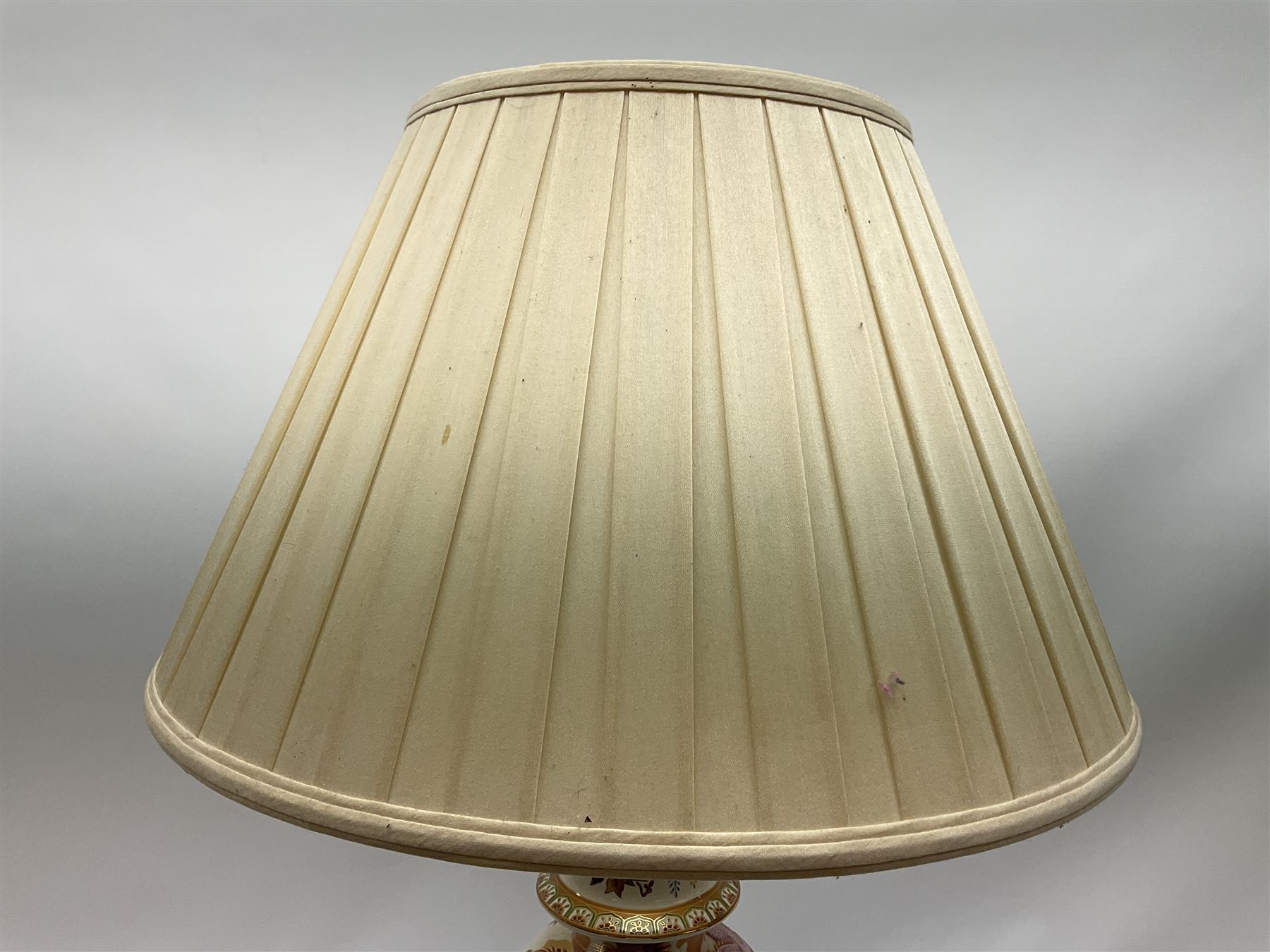 Table lamp of baluster form, decorated in the Oriental style with phoenix and dragon amidst blossoming flowers, with plated cream fabric shade, lamp base not including fixtures H35cm