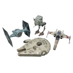 Star Wars - four space/land vehicles comprising Millenium Falcon with hinged top and figures; TIE Fighter; X-Wing Fighter with pilot; and AT-ST 'Chicken Walker' transporter; all unboxed (4)