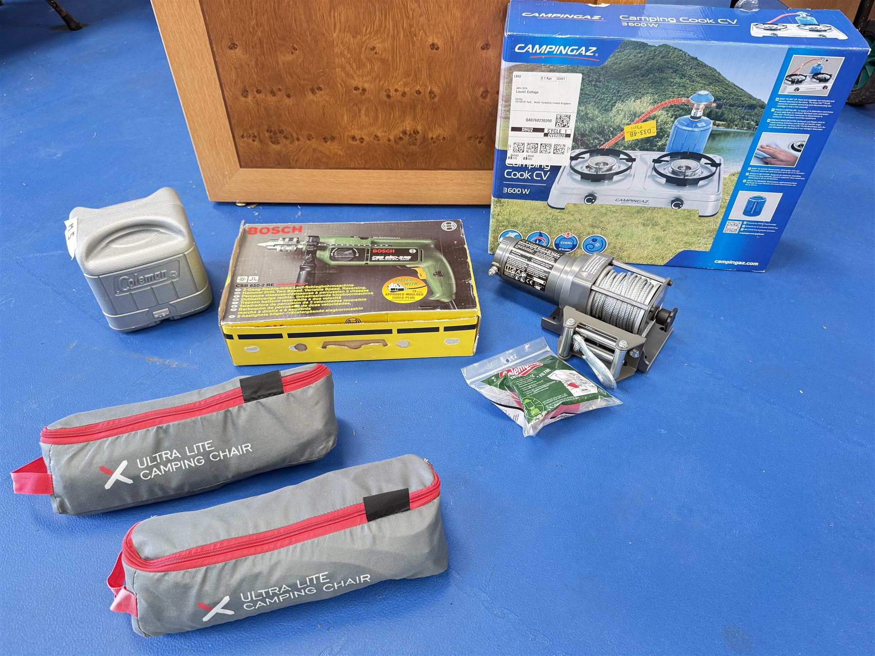 TimberTeck ESW12 electric winch, Bosch drill, Camping Cook stove, and two Ultra-Lite Camping chairs