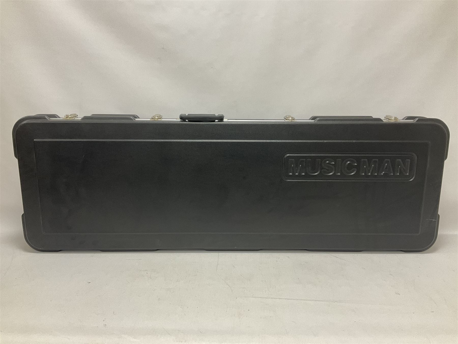 Music Man Bongo 4 string bass guitar, in sapphire black finish, serial no F42547, in black Music Man hard case, guitar L113cm