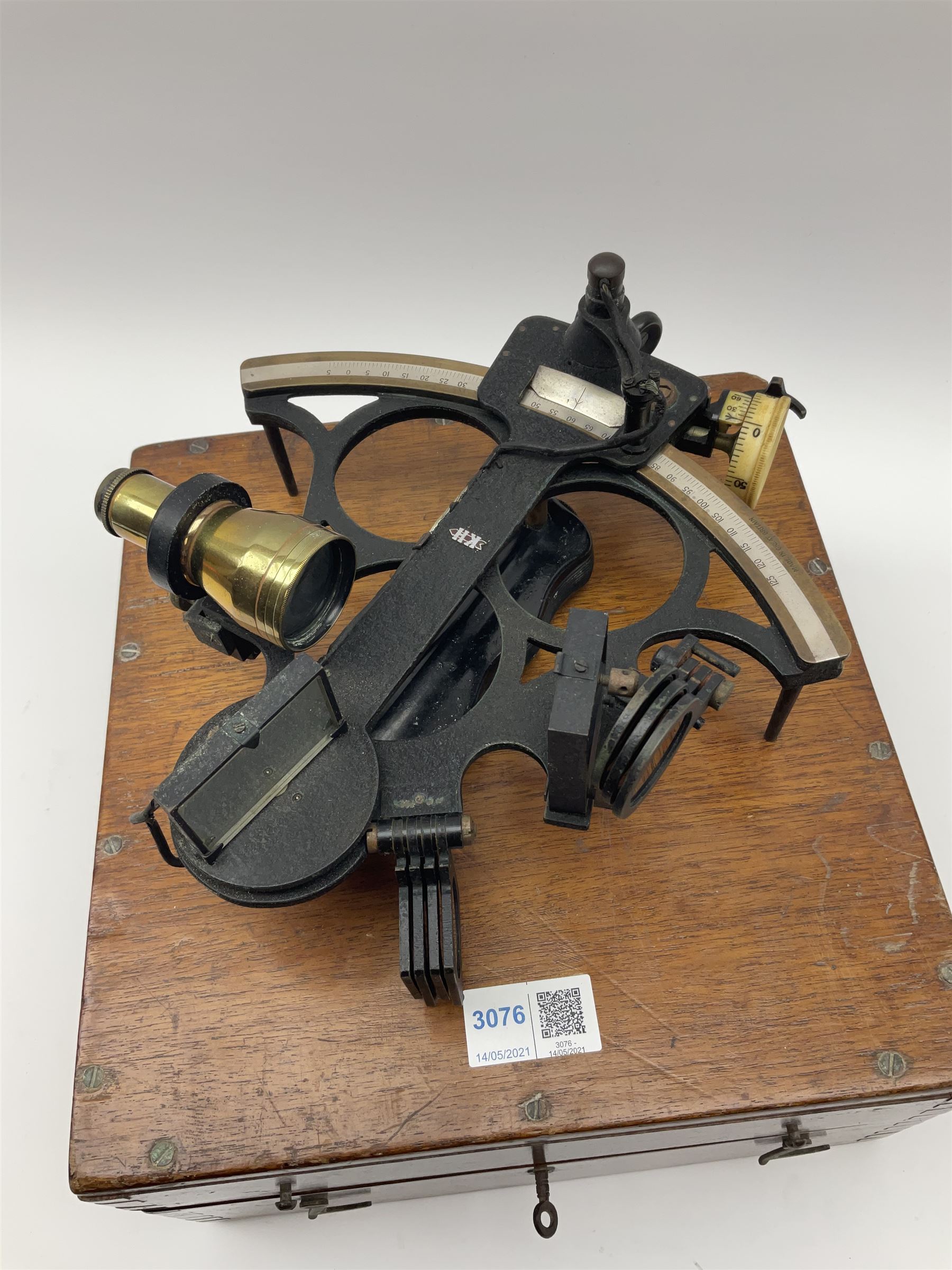 Henry Hughes & Son Ltd. sextant with black crackled finish, brass and silvered graduated arc and various coloured glass filters, serial no.60818, in fitted mahogany carrying box bearing Lilley & Reynolds Ltd. certificate dated 1962 W26cm