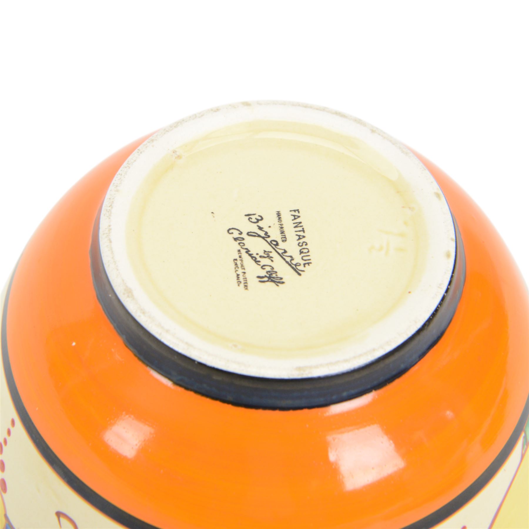 Clarice Cliff Fantasque Bizarre for Newport Pottery bowl, decorated in the Summerhouse pattern c.1931-1933, the exterior painted with stylised trees with yellow foliage and clouds bordered by black and orange bands, with black printed marks and impressed 1 1/2 beneath, D18.5cm