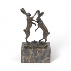 Bronze figure group, modelled as two male hares boxing, raised upon marble plinth base, si...