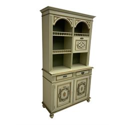 Portuguese painted dresser, two-tier plate rack with spindle gallery and fall-front cupboard, flanked by fluted uprights, fitted with two drawers over two cupboards, the panelled cupboards with floral decoration and a rinceaux border, white painted and parcel-gilt 