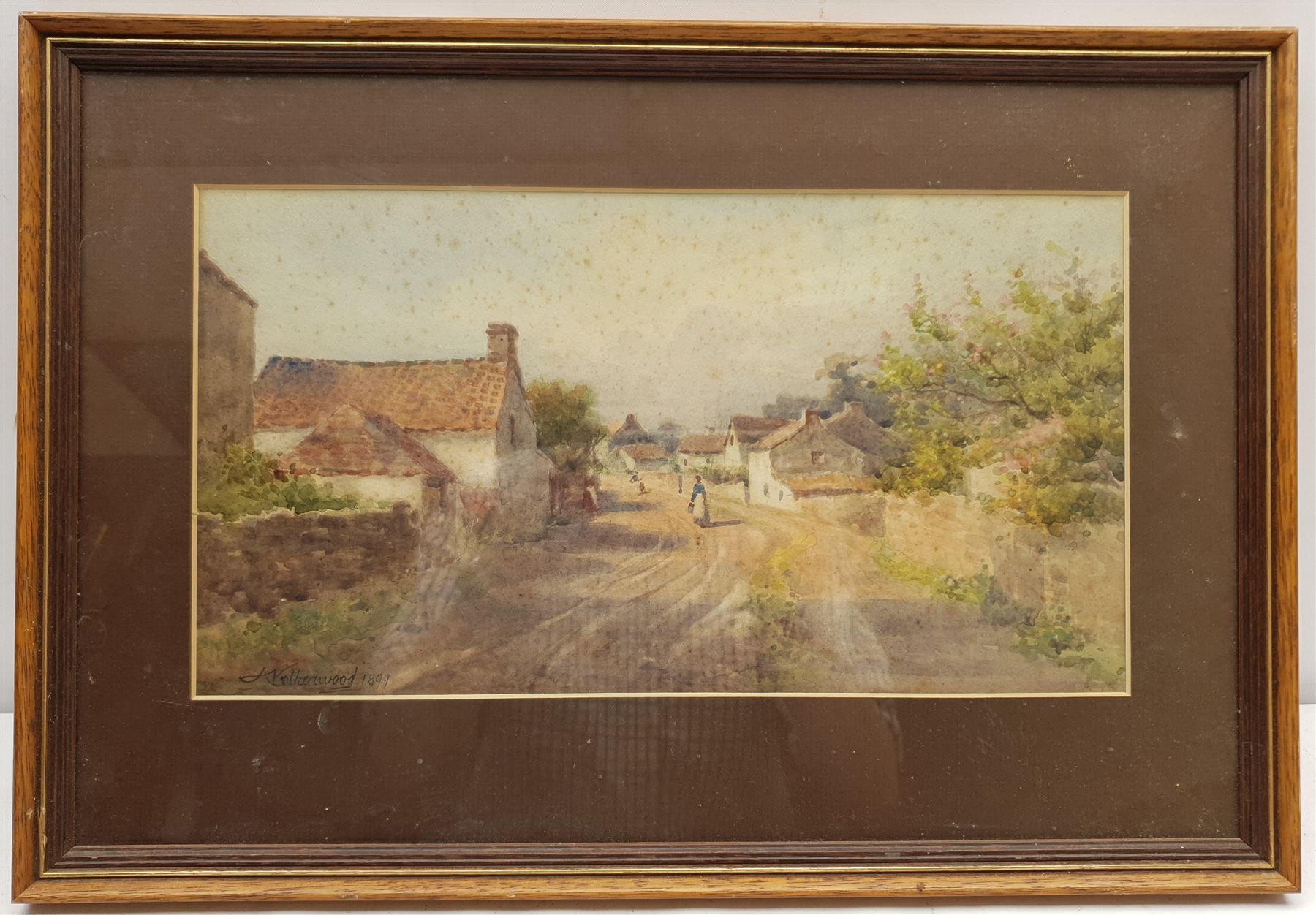 Arthur Netherwood (British 1864-1930): Village Street, watercolour signed and dated 1899, 19cm x 36cm
