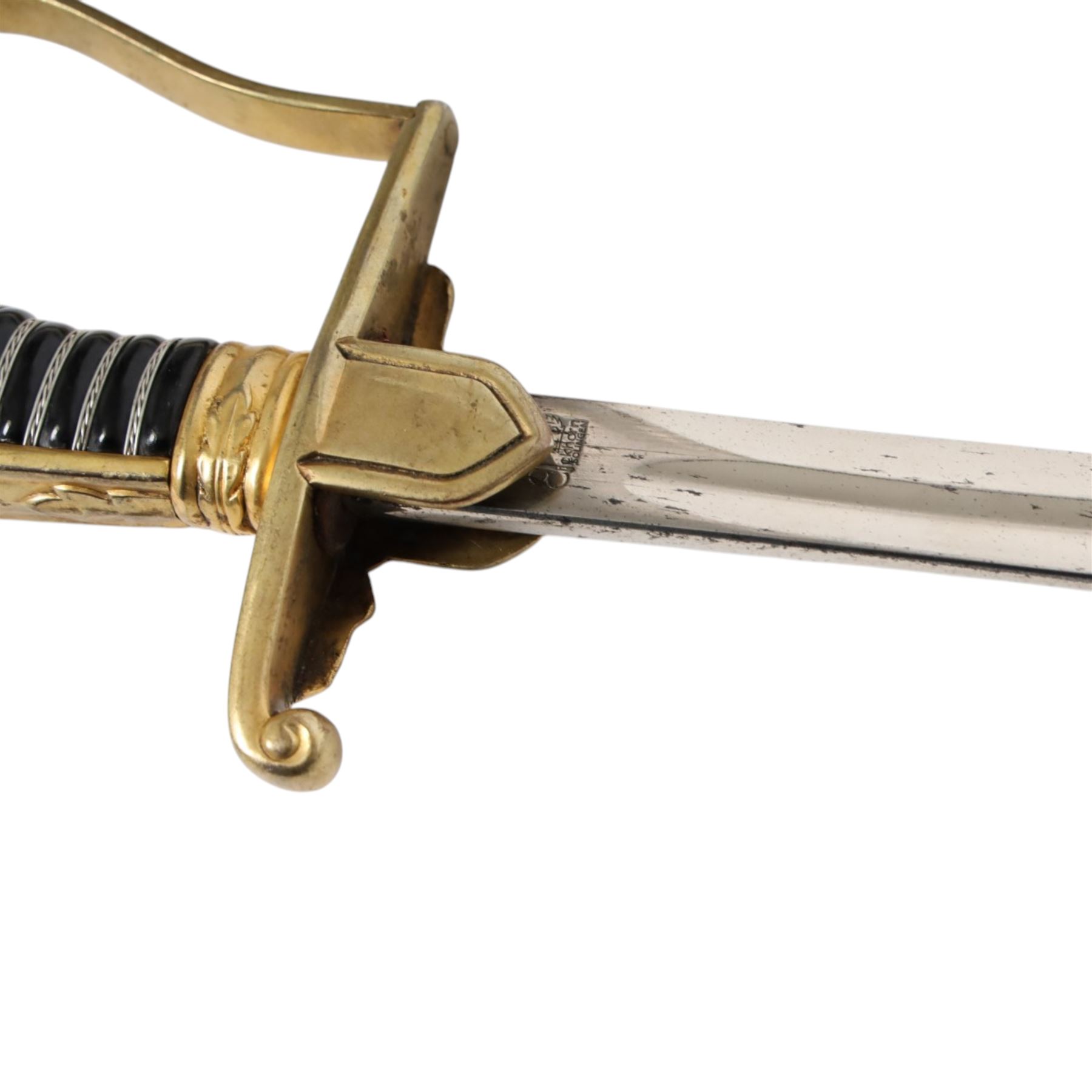 WWII German Army Prinz Eugen Pattern Officers Dress Sword by Carl Eickhorn, the 76cm slightly curving fullered blade with makers name to the ricasso, with gilt brass grip with eagle to the crossguard, guard with relief of oakleaves, Prinz Eugen style down winged eagle to the pommel of the backstrap, in original black painted scabbard with single hanging ring, overall L94cm