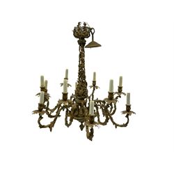 Mid-to-late 20th century gilt metal chandelier, on scrolled leaf and berry stem with twelve projecting serpentine leaf moulded branches