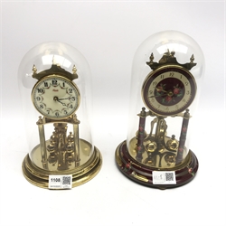 Late 20th century Kundo anniversary clock with enamel Arabic dial decorated with floral garlands and a late 20th century Koma anniversary clock, both under glass domes
