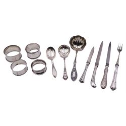 Group of silver, comprising modern silver handled letter opener, the handle decorated in low relief with Oriental scene set with pagodas, bridge and boat, hallmarked Yates Brothers, Sheffield 2000, a 1920's silver handled letter opener, hallmarked Sheffield 1928, makers mark GB, and a further silver handled letter opener, hallmarks worn and indistinct, probably Edwardian, a 20th century sauce ladle, probably American, with part fluted bowl and foliate detail to terminal, marked Sterling, an American silver spoon marked Sterling and marked for Gorham,1930's caddy spoon, an Edwardian silver handled pickle spoon, and four napkin rings, various hallmarks, dates ranging 1906 to 1924, approximate total gross weight 8.19 ozt (254.8 grams)