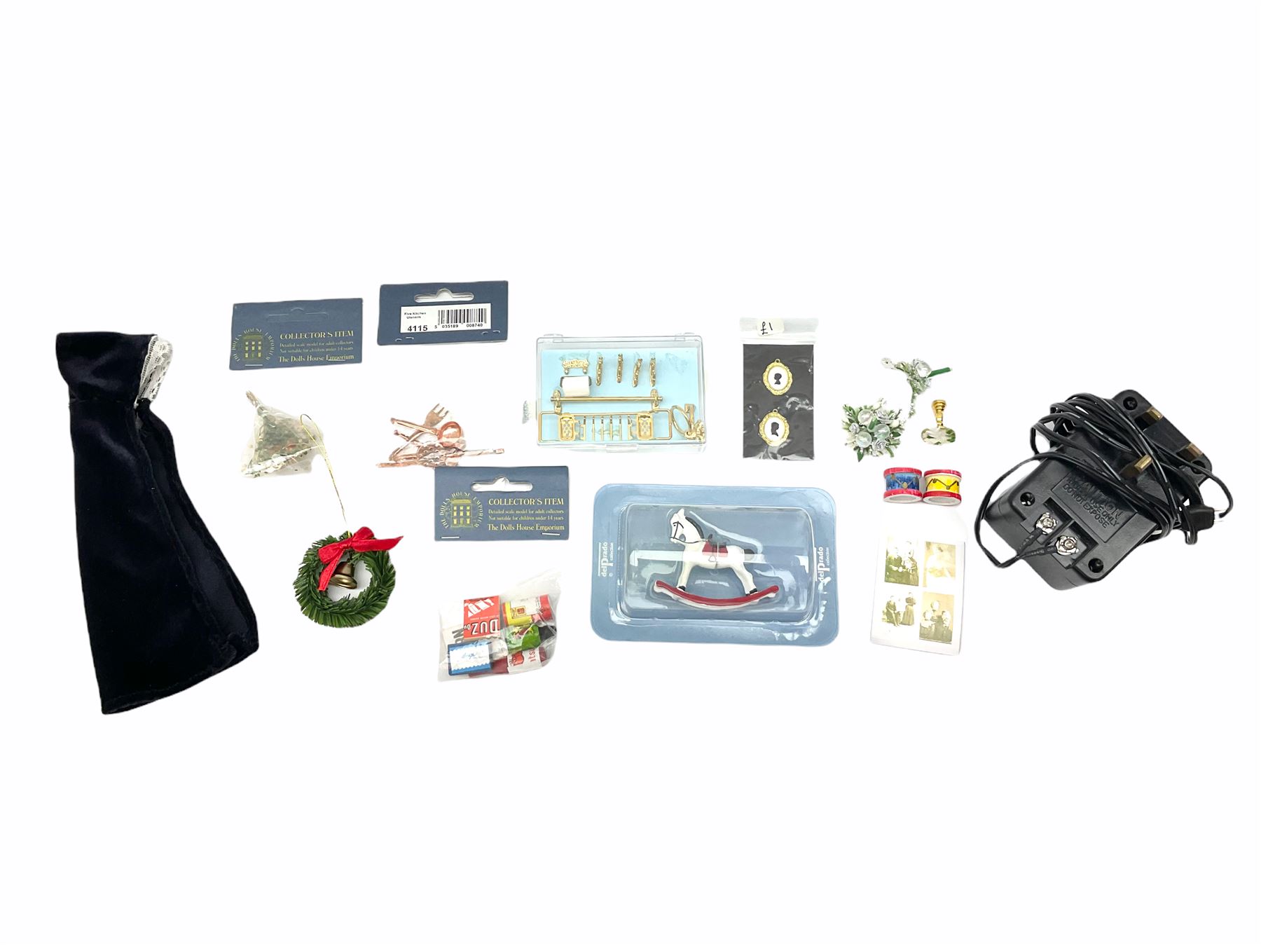 Georgian style wooden double fronted three-storey dolls house with pale blue stucco finish under a faux tiled roof with two chimney stacks, the double hinged front opening to reveal six fully decorated rooms with floor coverings, central staircase, porcelain fitted bathroom, kitchen with deep white sink and Aga cooker, electric lighting with adaptor, fully furnished with French style and other furniture, grand piano etc, and comprehensive range of accessories H82cm W61cm D31cm